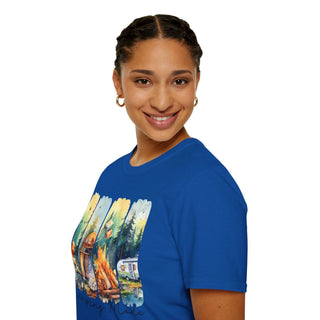 Smiling woman wearing a blue Camping Adventure Unisex T-Shirt with a colorful camping scene graphic on the front.