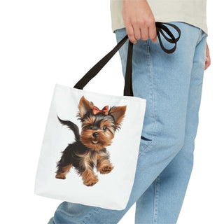 Yorkie puppy tote bag with hand-painted Yorkshire Terrier and red bow on white background, durable polyester with boxed corners and cotton handles.