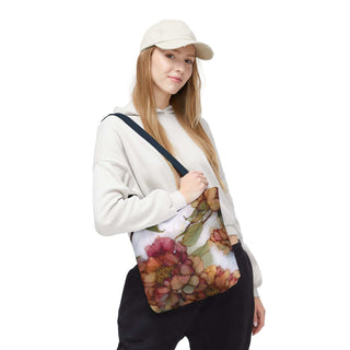 Vintage Peony Tote Bag with watercolor floral design in warm rose and apricot tones, worn with casual outfit