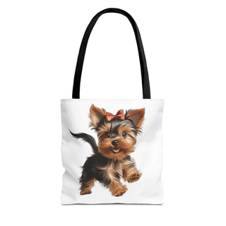 Yorkie puppy tote bag with red bow on white background, durable polyester and reinforced handles, available in three sizes