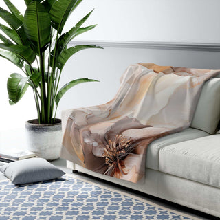 Neutral floral sherpa blanket with watercolor blooms and plush velvety backing in warm neutrals
