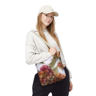 Woman carrying a vintage peony tote bag with watercolor floral design and adjustable strap