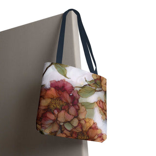 Vintage Peony Tote Bag with watercolor floral design in warm rose and apricot tones, navy handles, and reinforced stitching