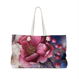 Chic floral weekender bag with cream rope handles and spacious 24x13 inch design for stylish travel.