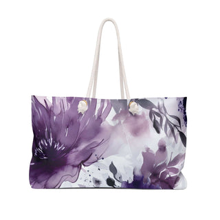Purple and white floral weekender bag with rope handles and spacious interior