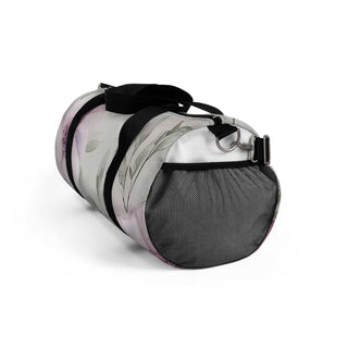 Small floral pattern duffel bag with black straps and side mesh pocket