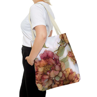 Woman carrying Vintage Peony Tote Bag with watercolor floral design in rose, apricot, and olive tones