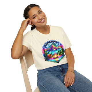 Woman wearing Camping Vibes Unisex softstyle t-shirt with colorful camping graphic sitting on chair smiling