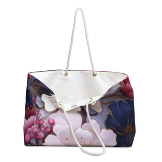 Chic floral weekender bag with cream rope handles and spacious interior, ideal for stylish travel and weekend getaways.