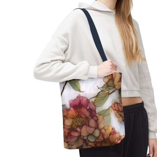 Vintage Peony Tote Bag with watercolor floral design and navy handles carried by woman in casual outfit