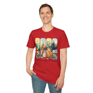 Red unisex t-shirt with camping-themed graphic featuring campfire, tent, and forest scenes, worn by smiling man.