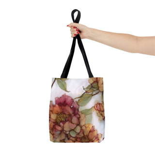vintage peony tote bag with watercolor floral design and black handles held by hand