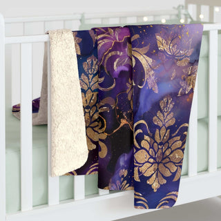 Luxurious gold damask sherpa blanket with plush velvet sherpa reverse and ornate deep indigo design
