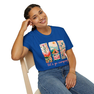 Woman wearing blue unisex Camping Adventure T-shirt with colorful nature and camper design sitting on chair