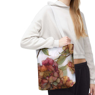 Woman carrying vintage peony tote bag with watercolor floral design and white strap