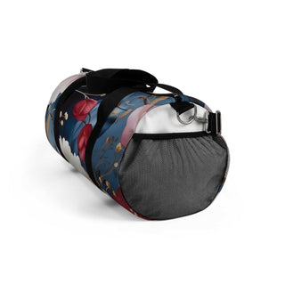 Small floral duffel bag with black straps and vibrant flower pattern for travel and gym use