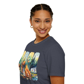 Woman wearing a dark Camping Adventure Unisex T-Shirt with a colorful outdoor campfire and camper design, smiling and posing against a white background.