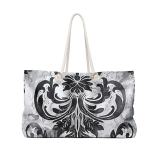 Chic vintage weekender bag with black and white pattern, cream rope handles, and spacious 24x13 inch size