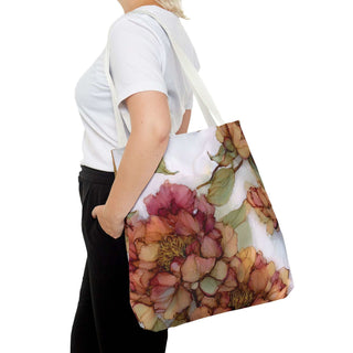 Vintage Peony Tote Bag with watercolor-style floral design in warm rose and apricot tones carried by person with white strap handles