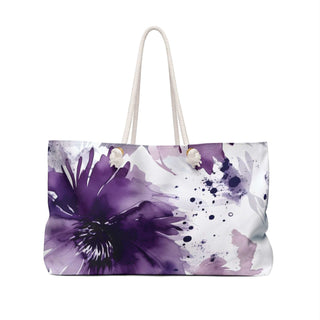 Purple and white floral weekender bag with rope handles and spacious interior