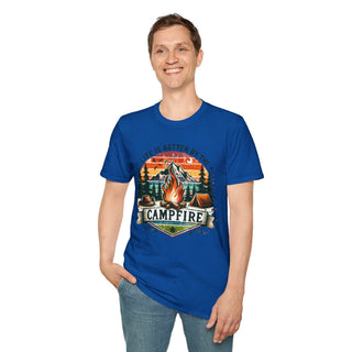 Man wearing blue Camping Adventure Unisex T-Shirt with "Life is Better by the Campfire" campfire design
