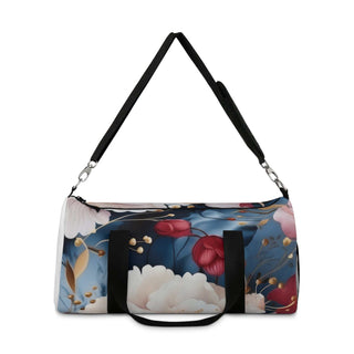 Floral duffel bag with vibrant flower print, black handles, and adjustable shoulder strap for travel and gym use