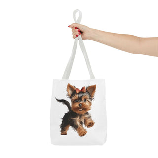 Yorkie puppy tote bag with hand-painted Yorkshire Terrier and red bow on white background, durable polyester tote with boxed corners and cotton handles.