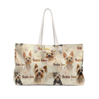 Cream canvas Yorkie Love weekender bag with watercolor Yorkie portraits and rope handles, 24" x 13" size.