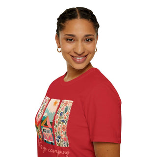 woman wearing red unisex softstyle t-shirt with colorful camping adventure design including van and nature elements